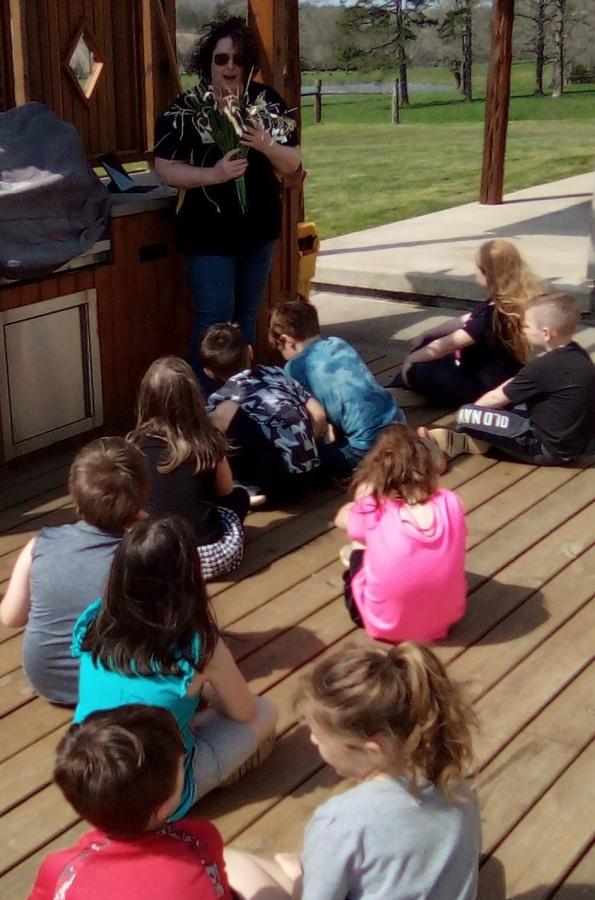 Group of 2nd graders at the quail station at the Ag Day 22